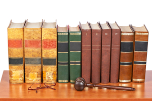 Wooden gavel and old law books